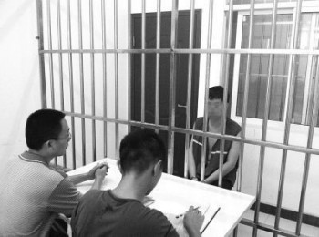 Mr. Tang, one of the bosses of the black PR firm, being questioned.