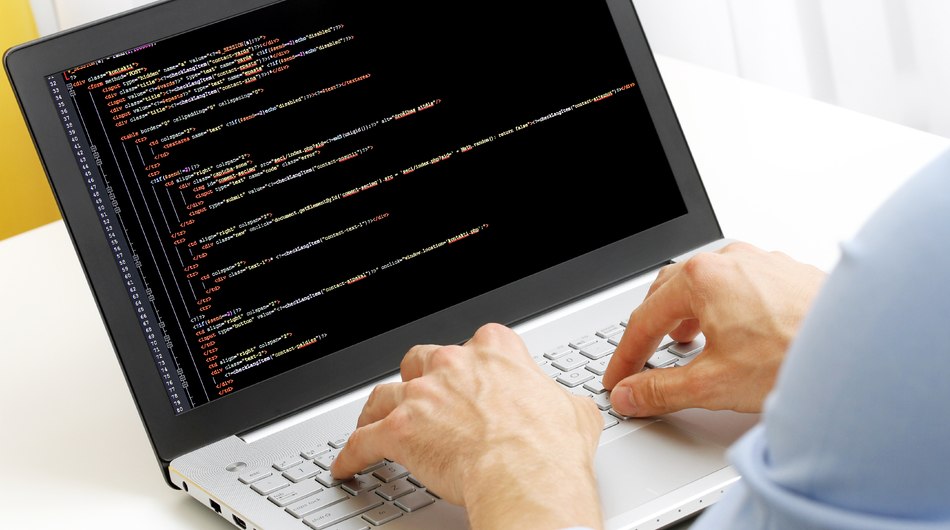 Software development, coding, programming on laptop