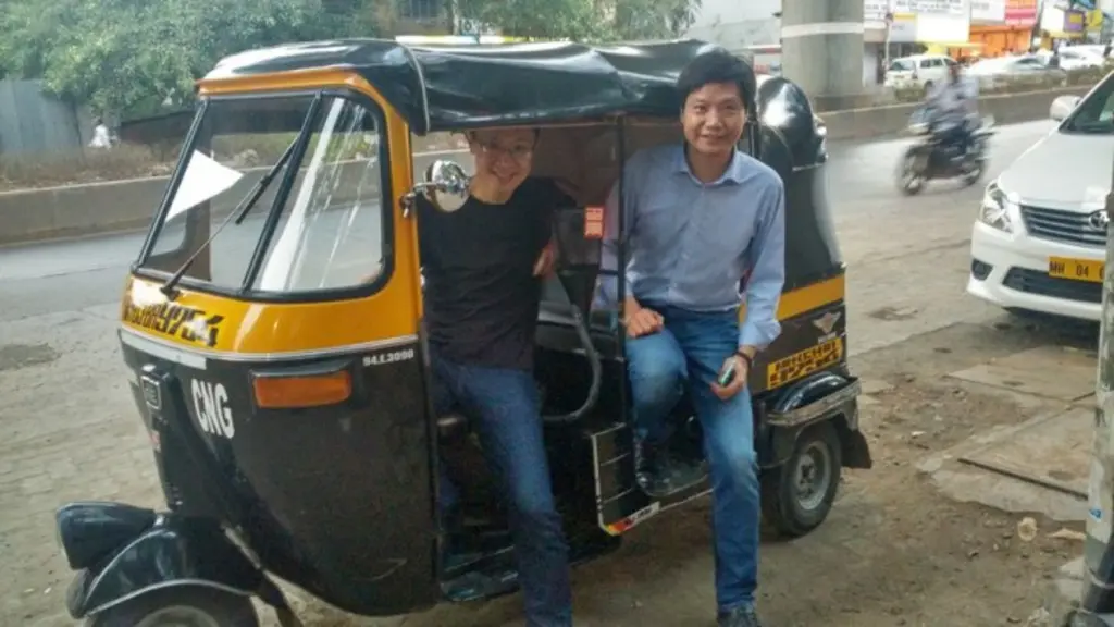 Xiaomi founder Jun Lei and Bin Lin in an auto rickshaw in India