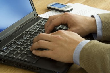 Business man Writing on Laptop