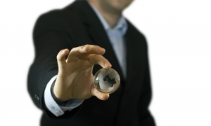 Businessman holding crystal globe
