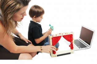 Mother and boy play puppets during video-conference C Splaype 2011