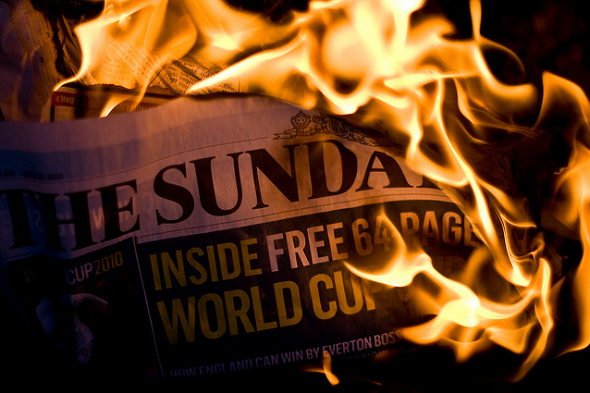 burning newspaper