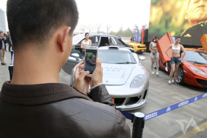 guy taking picture with smartphone