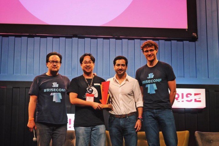 Julian Lee accepting his top prize with Casey Lau (far left), Google's Ricky Kapur (second from right), and Paddy Cosgrave, CEO of Web Summit (far right)