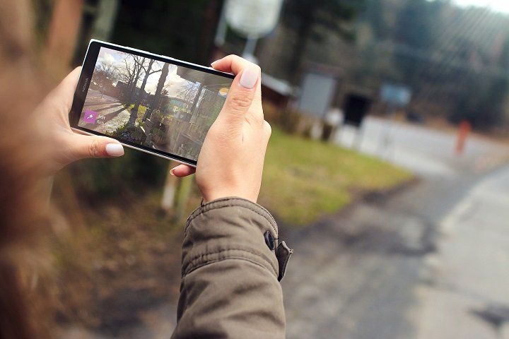 woman holding smartphone