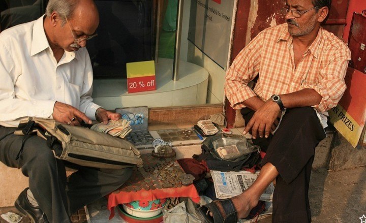 Photo credit: carol mitchell. Roadside banking in Chandni Chowk, Delhi