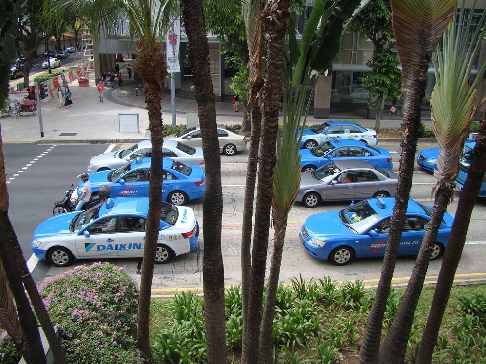 Taxis waiting at traffic light in Singapore