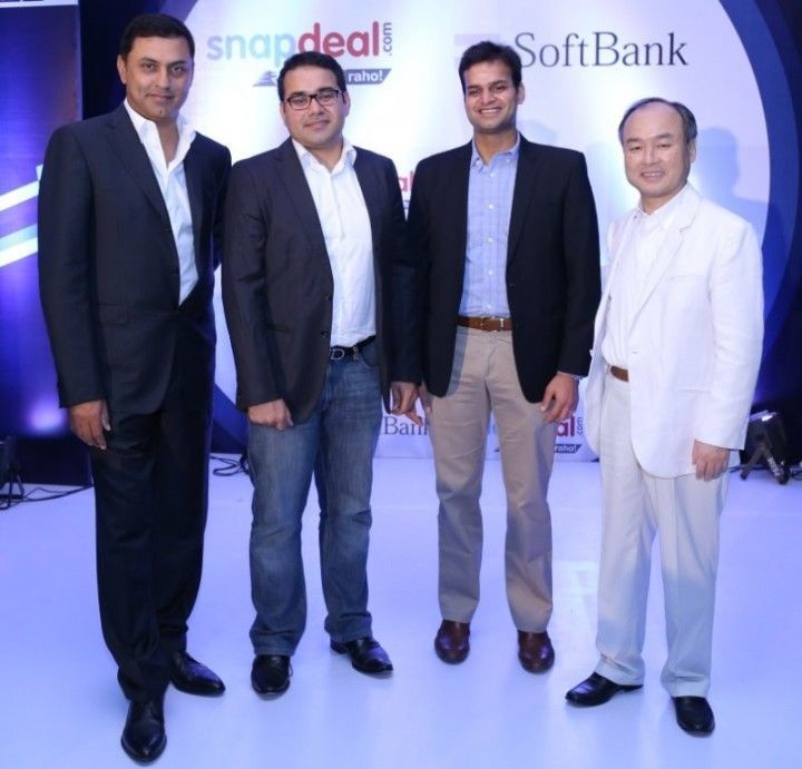 (Second from left in specs) Kunal Bahl, cofounder and CEO of Snapdeal, with cofounder Rohit Bansal (third from left) and Softbank founder Masayoshi Son (extreme right).   