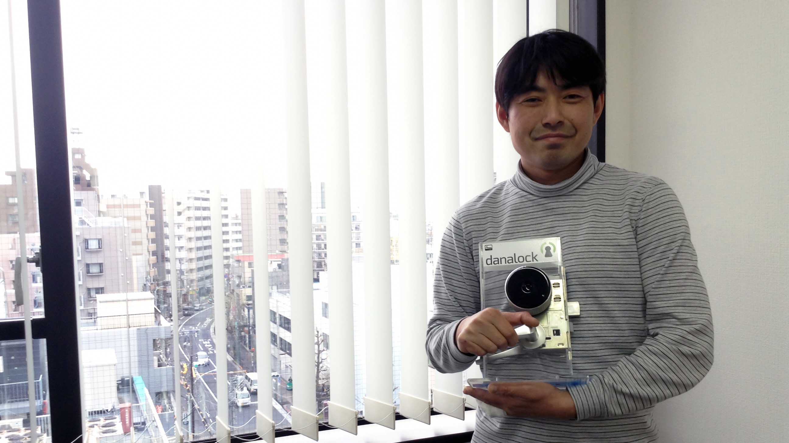 Founder and CEO Makoto Ogawa shows off one of Z-Works' smart locks.