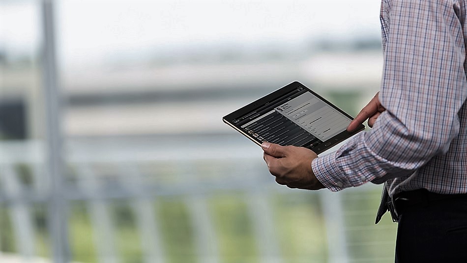 Man checking data on tablet