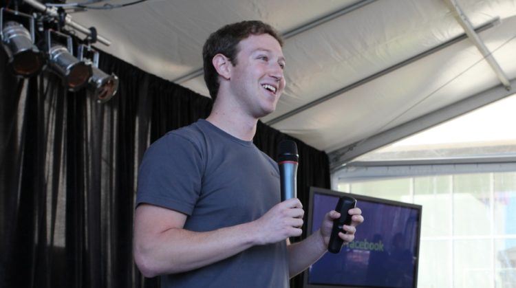 Zuckerberg, laughing