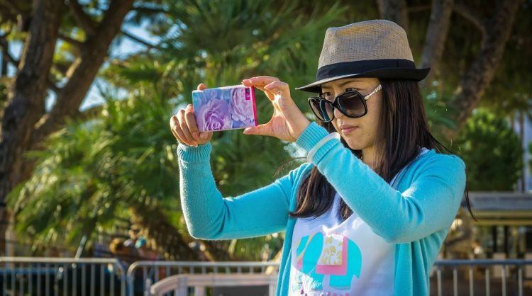 Girl taking picture on smartphone