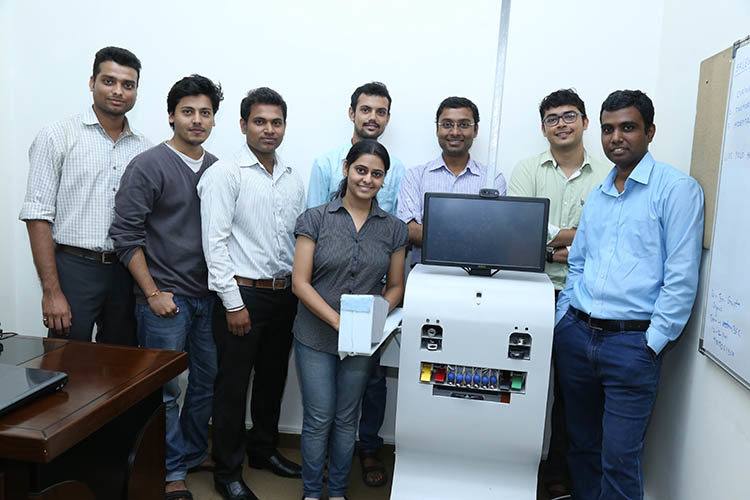 Yolo Health's team, along with one of their ATMs. Photo credit: YOLO Health.