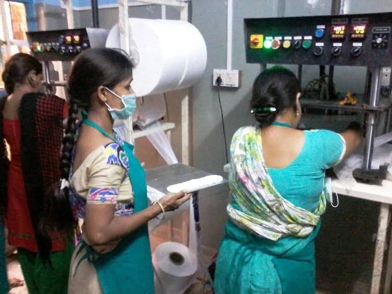 Women making sanitary pads at Mukti's production unit.