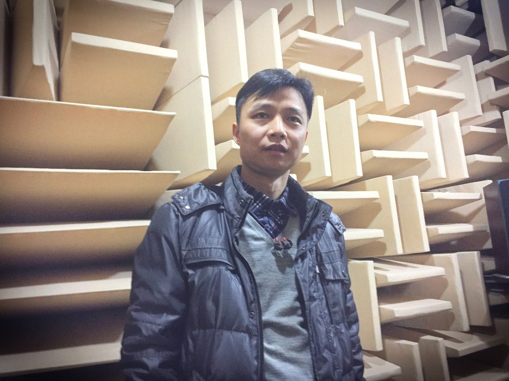 Inside FIIL's anechoic chamber with CTO Leon Wu at its R&D center. Photo credit: Tech in Asia.