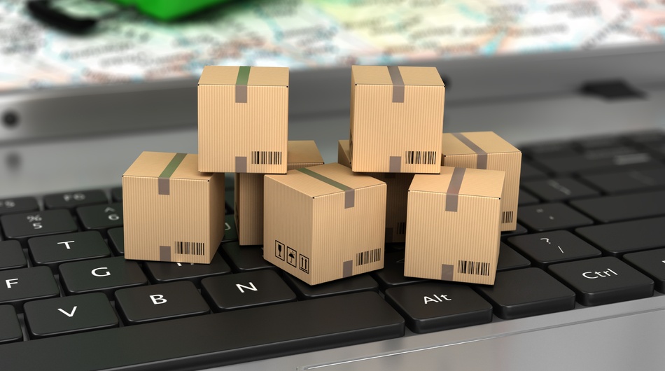 Ecommerce logistics and delivery, boxes on keyboard