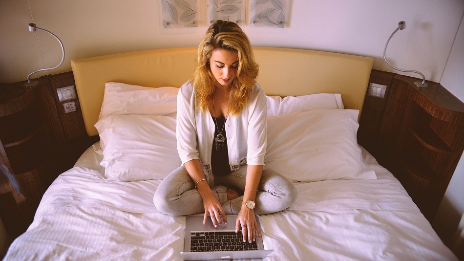 Woman in hotel room, bed, hotel, laptop, guest, travel