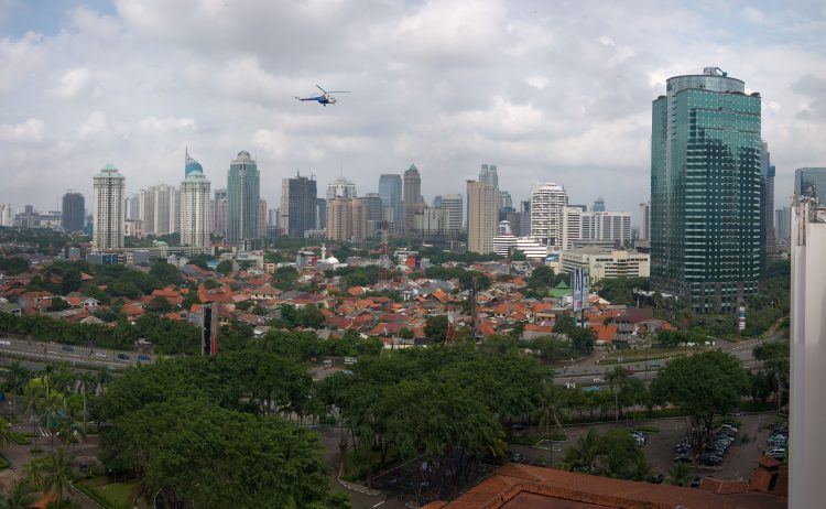 Helicopter flying over Jakarta.