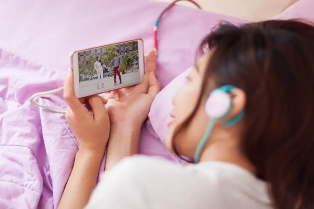 Asian girl streaming video on mobile