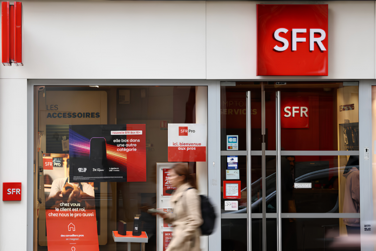 French telecom firms sign $23b SFR takeover deal French telecom firms sign $23b SFR takeover deal